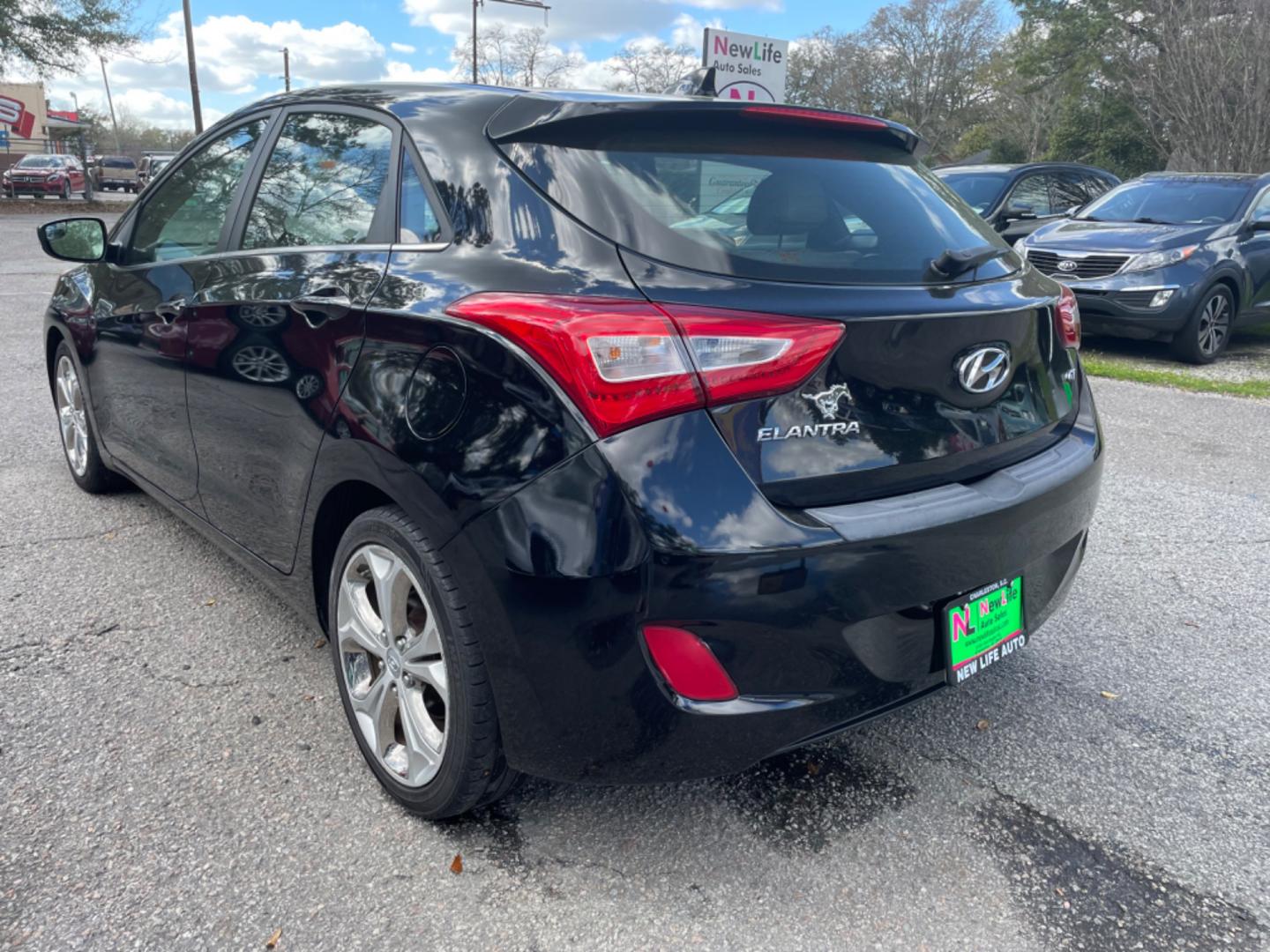 2014 BLACK HYUNDAI ELANTRA GT BASE (KMHD35LH8EU) with an 2.0L engine, Automatic transmission, located at 5103 Dorchester Rd., Charleston, SC, 29418-5607, (843) 767-1122, 36.245171, -115.228050 - Photo#4